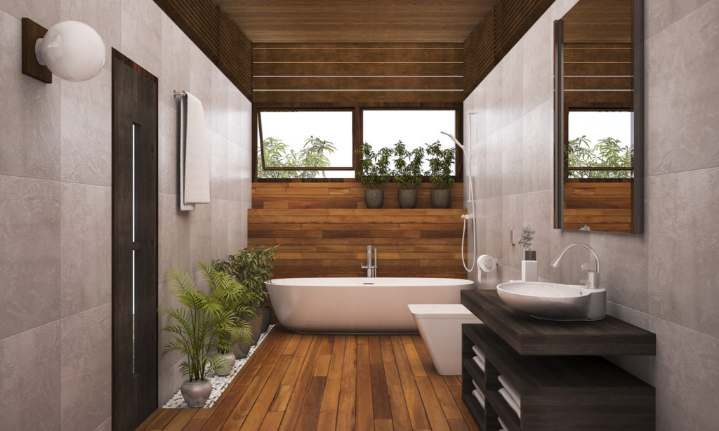 La pose d’un parquet en bois massif donne un côté chaleureux à votre salle de bain.